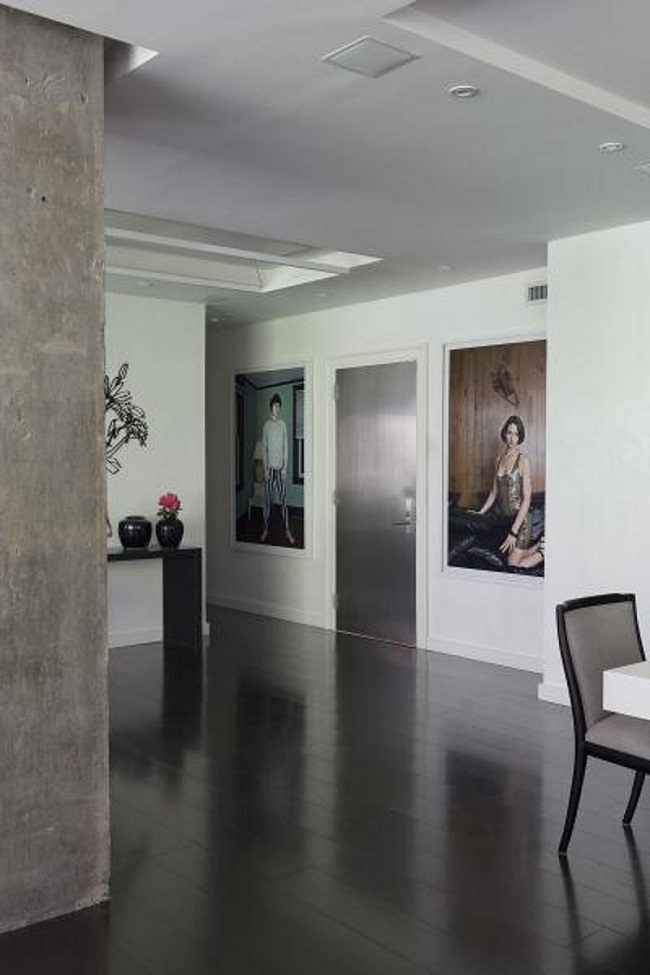 A room with two paintings on the wall