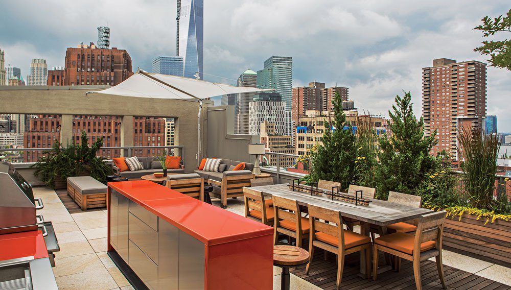 A large outdoor dining area with a view of the city.