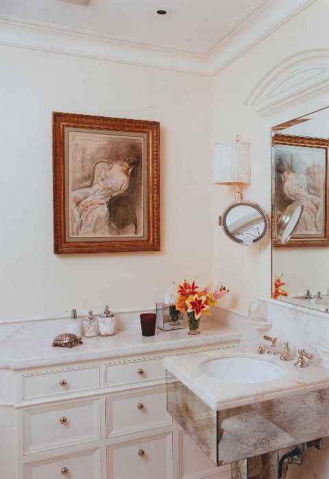 A white sink in a bathroom.