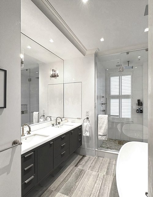 A modern bathroom with a large tub and sink.