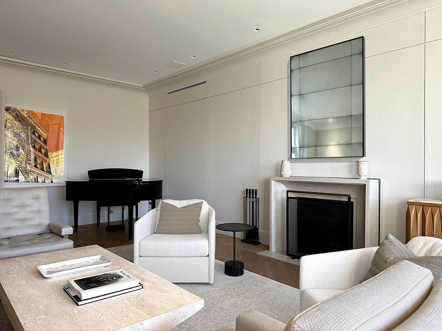 A living room with a piano and a couch.