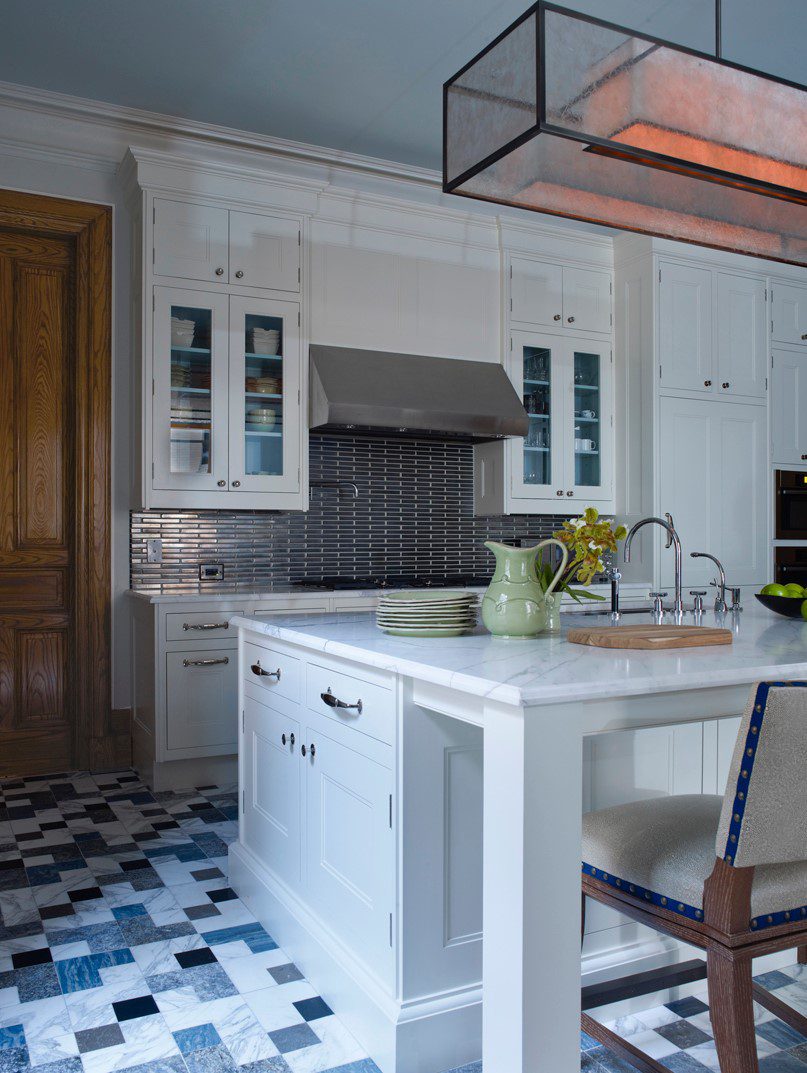 A kitchen with a blue and white checkered floor.