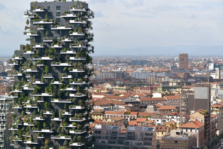 Vertical forest residential tower overlooking city skyline