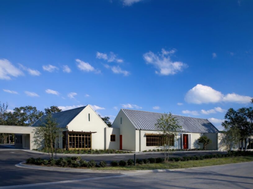 Contemporary Florida oncology clinic with steep gabled roofs and regional architectural detailing