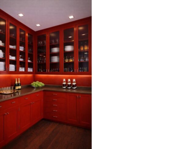 Red lacquer pantry at The Majestic featuring illuminated cabinetry and Art Deco–inspired detailing